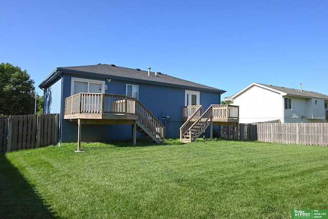 2412 Lewis And Clark Rd, Bellevue, NE 68123 - back of property featuring stairway, a deck, and a fenced backyard