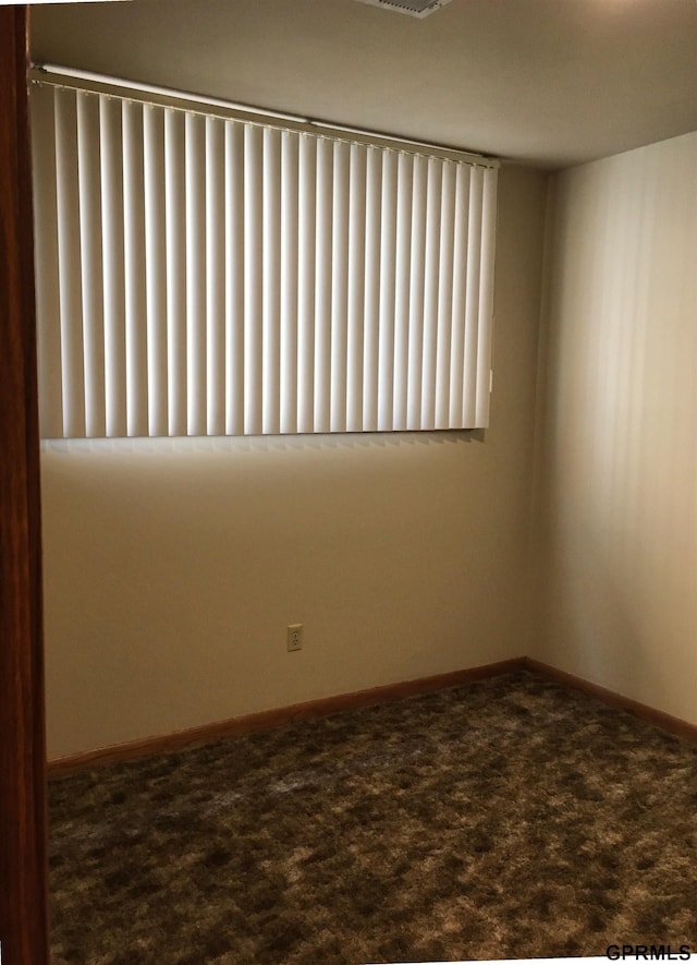 1321 D St, Lincoln, NE 68502 - carpeted spare room with radiator heating unit and baseboards