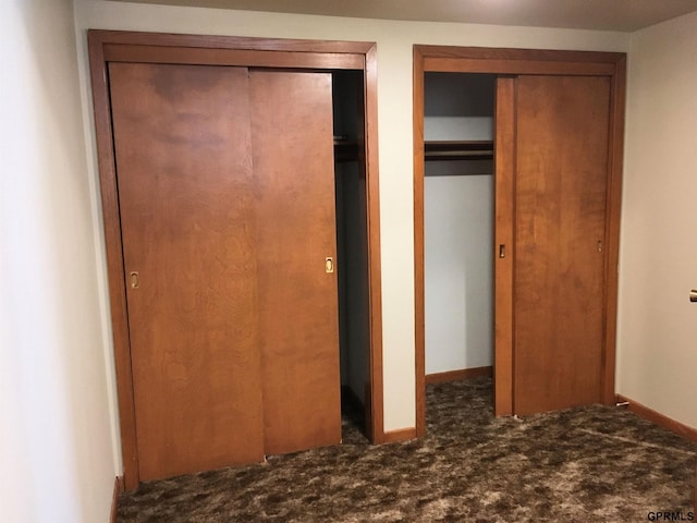 1321 D St, Lincoln, NE 68502 - unfurnished bedroom featuring carpet and two closets