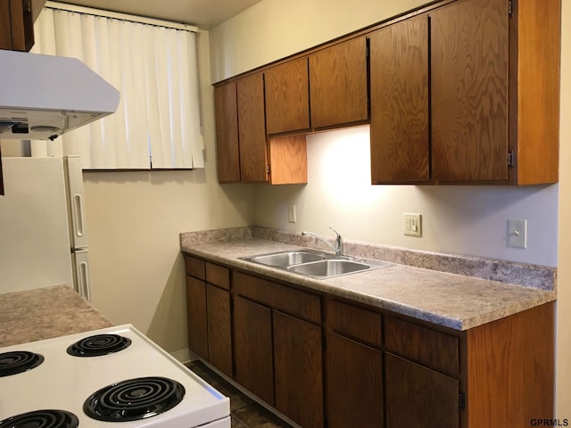 1321 D St, Lincoln, NE 68502 - kitchen with white appliances, light countertops, and extractor fan