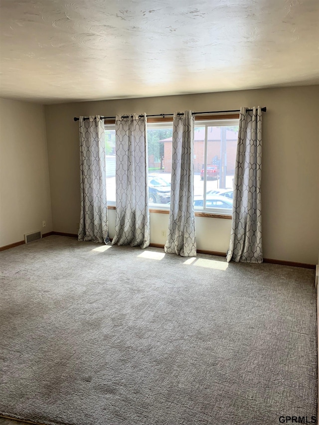 1321 D St, Lincoln, NE 68502 - carpeted empty room with healthy amount of natural light
