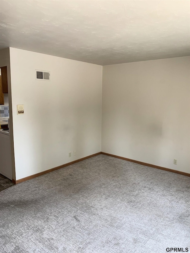 1321 D St, Lincoln, NE 68502 - carpeted spare room featuring baseboards