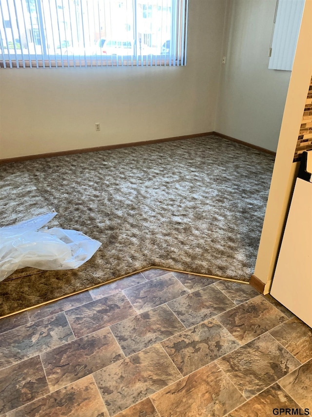 1321 D St, Lincoln, NE 68502 - unfurnished room featuring plenty of natural light and carpet flooring