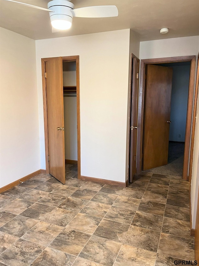 1321 D St, Lincoln, NE 68502 - unfurnished bedroom with a ceiling fan and stone finish floors
