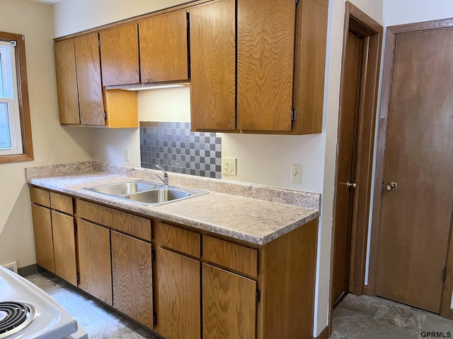 1321 D St, Lincoln, NE 68502 - kitchen with light countertops, brown cabinets, and white range
