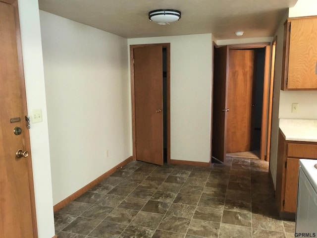 1321 D St, Lincoln, NE 68502 - interior space with light countertops, brown cabinets, and stone finish flooring