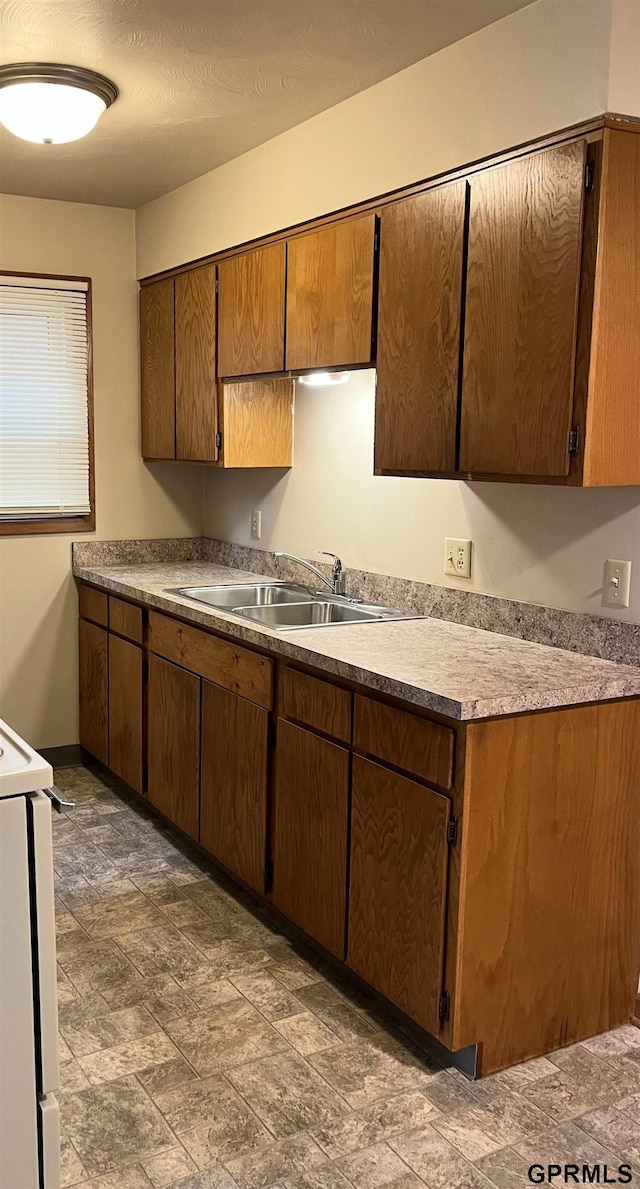 1321 D St, Lincoln, NE 68502 - kitchen with range and stone finish floors
