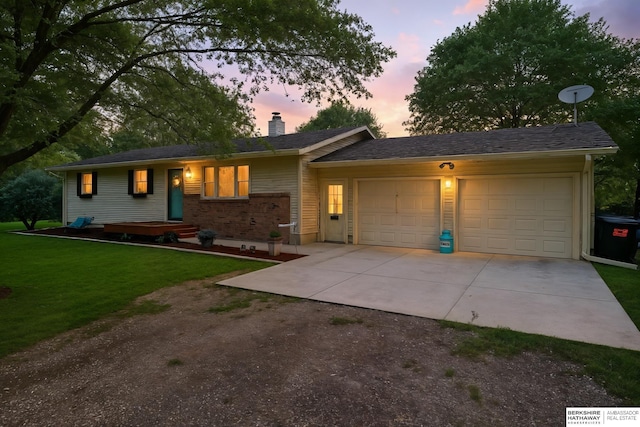 6848 E Military Ave, Fremont, NE 68025 - single story home featuring driveway, a garage, a chimney, and a front yard