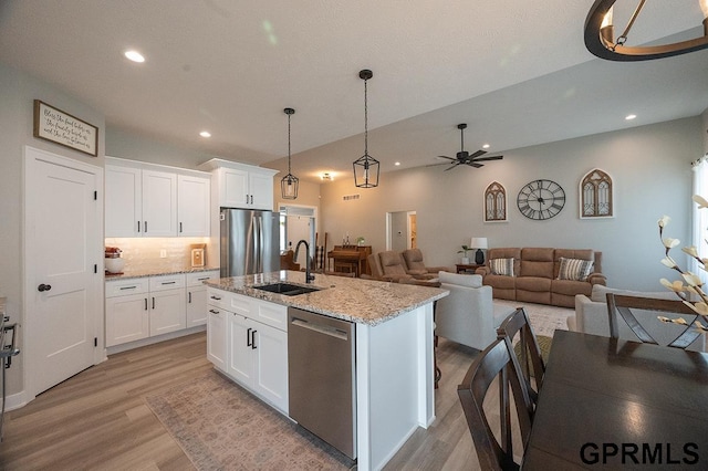 1600 W Avalanche Rd, Lincoln, NE 68521 - kitchen featuring stainless steel appliances, light wood-style floors, recessed lighting, a ceiling fan, and white cabinetry