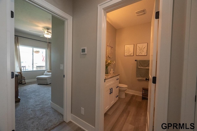 1600 W Avalanche Rd, Lincoln, NE 68521 - bathroom featuring vanity, wood finished floors, and a ceiling fan