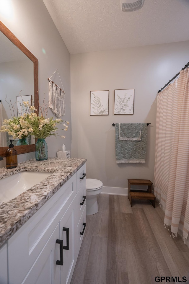 1600 W Avalanche Rd, Lincoln, NE 68521 - full bath with wood finished floors, vanity, and a shower with shower curtain