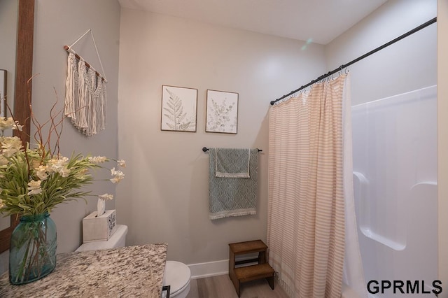 1600 W Avalanche Rd, Lincoln, NE 68521 - bathroom featuring wood finished floors and vanity