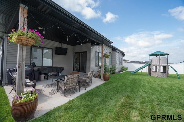 1600 W Avalanche Rd, Lincoln, NE 68521 - fenced backyard featuring a playground, a patio, and an outdoor hangout area