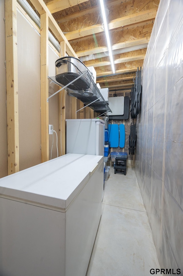 1600 W Avalanche Rd, Lincoln, NE 68521 - unfinished below grade area with refrigerator