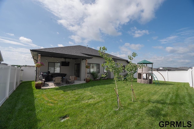 1600 W Avalanche Rd, Lincoln, NE 68521 - back of house with a playground, a patio, a fenced backyard, and an outdoor living space