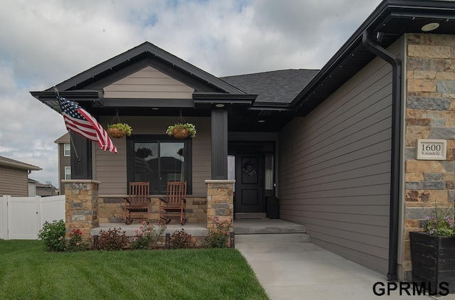 1600 W Avalanche Rd, Lincoln, NE 68521 - view of exterior entry with covered porch and stone siding
