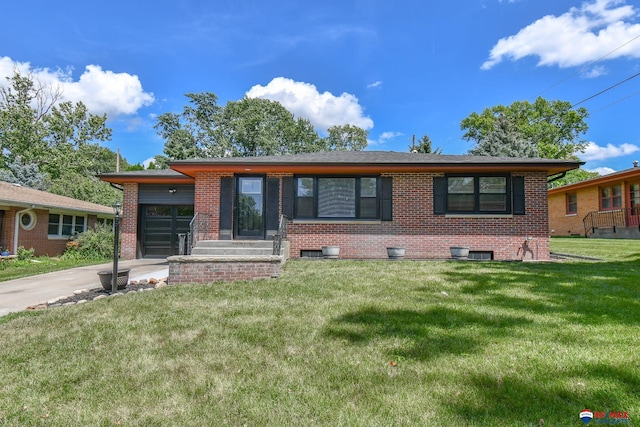 1210 S 44th St, Lincoln, NE 68510 - view of front of house featuring brick siding, an attached garage, a front yard, and concrete driveway