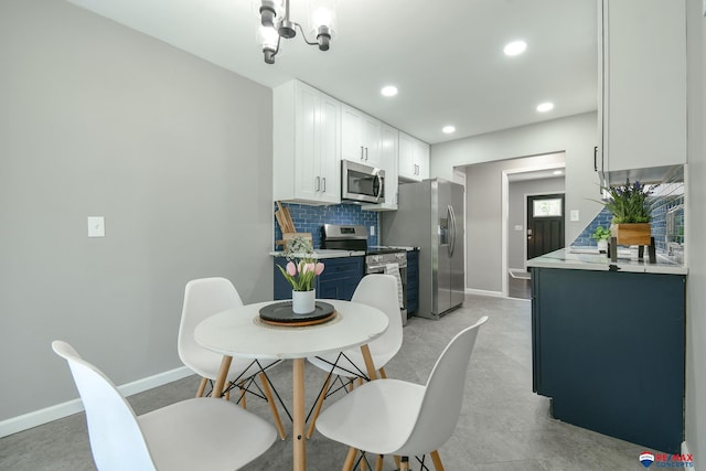 1210 S 44th St, Lincoln, NE 68510 - dining room with recessed lighting and a chandelier