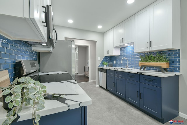 1210 S 44th St, Lincoln, NE 68510 - kitchen with appliances with stainless steel finishes, tasteful backsplash, white cabinets, light stone countertops, and recessed lighting