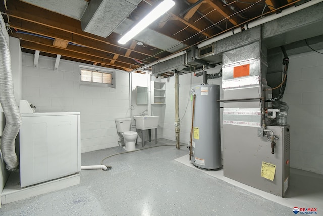 1210 S 44th St, Lincoln, NE 68510 - basement featuring washer / dryer, gas water heater, and heating unit