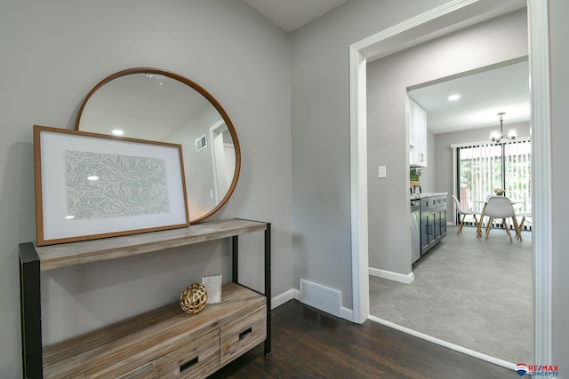 1210 S 44th St, Lincoln, NE 68510 - hall featuring a chandelier, recessed lighting, and dark wood-style flooring