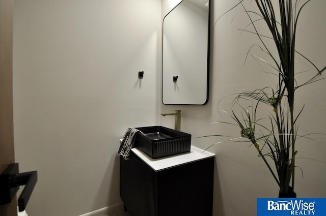 7101 S St Unit 1, Lincoln, NE 68506 - bathroom with baseboards and vanity