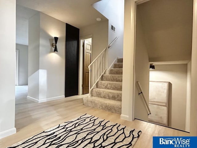 7101 S St Unit 1, Lincoln, NE 68506 - stairs featuring wood finished floors and baseboards