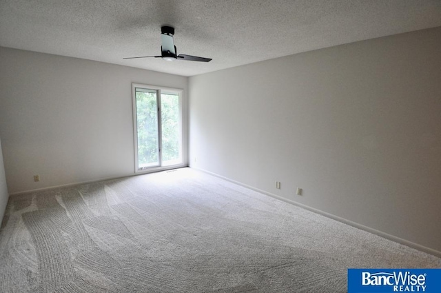 7101 S St Unit 1, Lincoln, NE 68506 - carpeted spare room with a ceiling fan and a textured ceiling