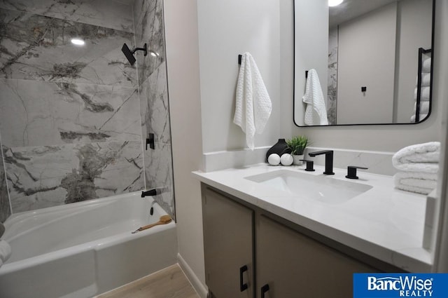 7101 S St Unit 1, Lincoln, NE 68506 - bathroom featuring vanity, shower / bath combination, and wood finished floors