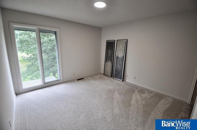 7101 S St Unit 1, Lincoln, NE 68506 - unfurnished room featuring light carpet and baseboards