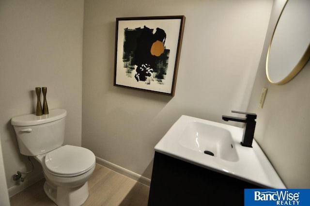 7101 S St Unit 1, Lincoln, NE 68506 - bathroom featuring vanity and wood finished floors