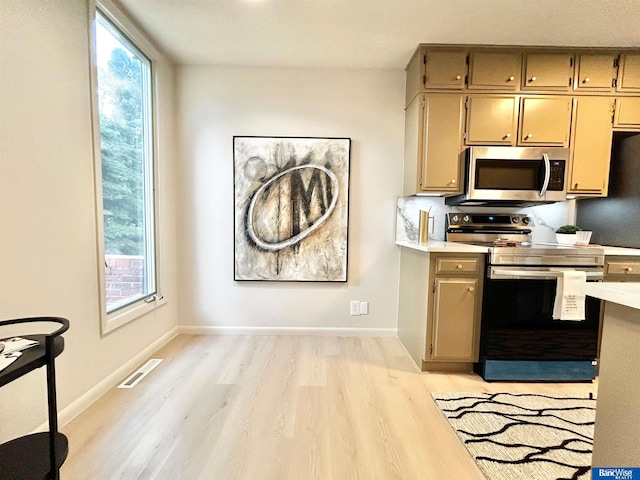 7101 S St Unit 1, Lincoln, NE 68506 - kitchen with appliances with stainless steel finishes, light wood-style flooring, and light countertops