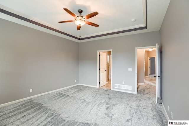 8023 S 193rd St, Gretna, NE 68028 - unfurnished bedroom with a tray ceiling, carpet, crown molding, and ceiling fan