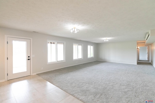 5241 Troon Dr, Lincoln, NE 68526 - foyer with carpet floors and a textured ceiling