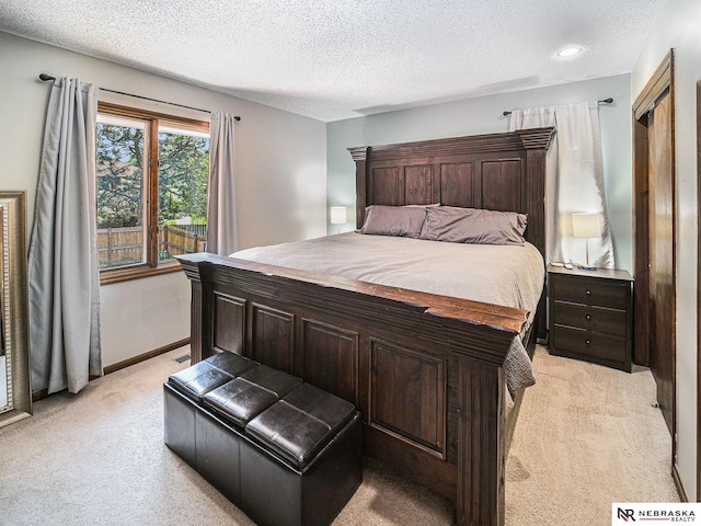 7533 Sherman St, Lincoln, NE 68506 - bedroom featuring light colored carpet, a textured ceiling, and recessed lighting