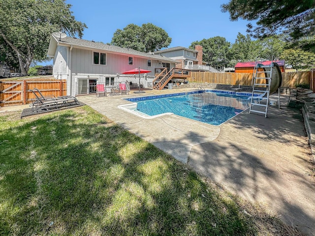7533 Sherman St, Lincoln, NE 68506 - view of swimming pool featuring a fenced backyard, a patio, and stairway
