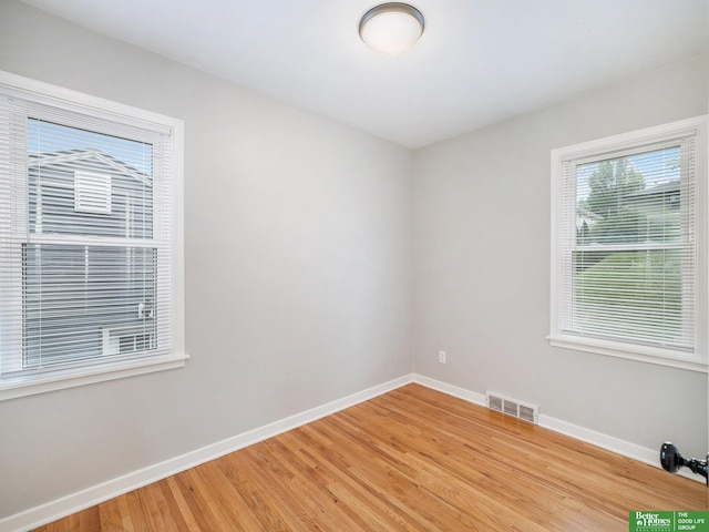 5075 Frances St, Omaha, NE 68106 - empty room with baseboards and light wood-style floors