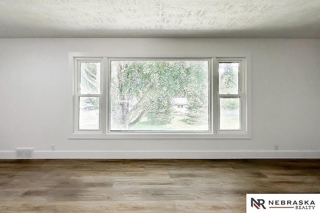 1113 S 94th St, Omaha, NE 68124 - empty room with baseboards and wood finished floors