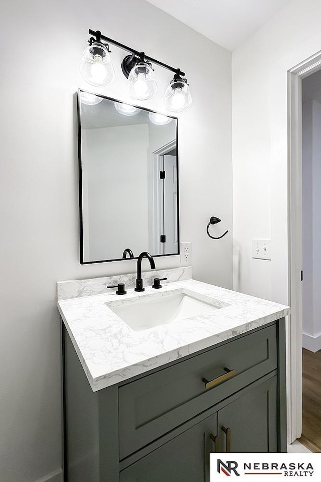 1113 S 94th St, Omaha, NE 68124 - bathroom with vanity and wood finished floors
