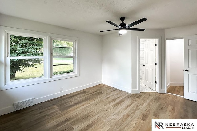 1113 S 94th St, Omaha, NE 68124 - unfurnished room with wood finished floors and a ceiling fan