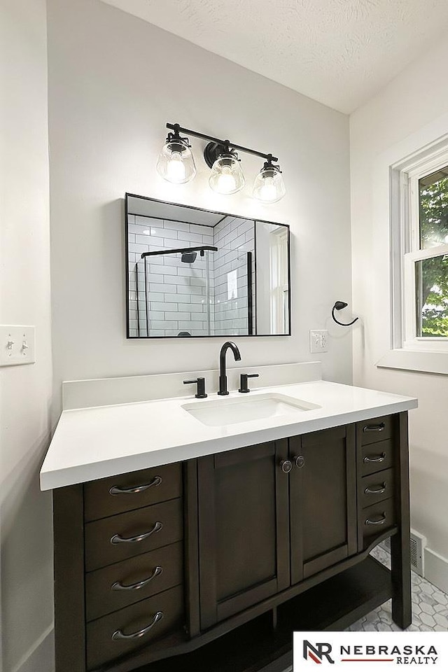 1113 S 94th St, Omaha, NE 68124 - bathroom featuring vanity and a textured ceiling