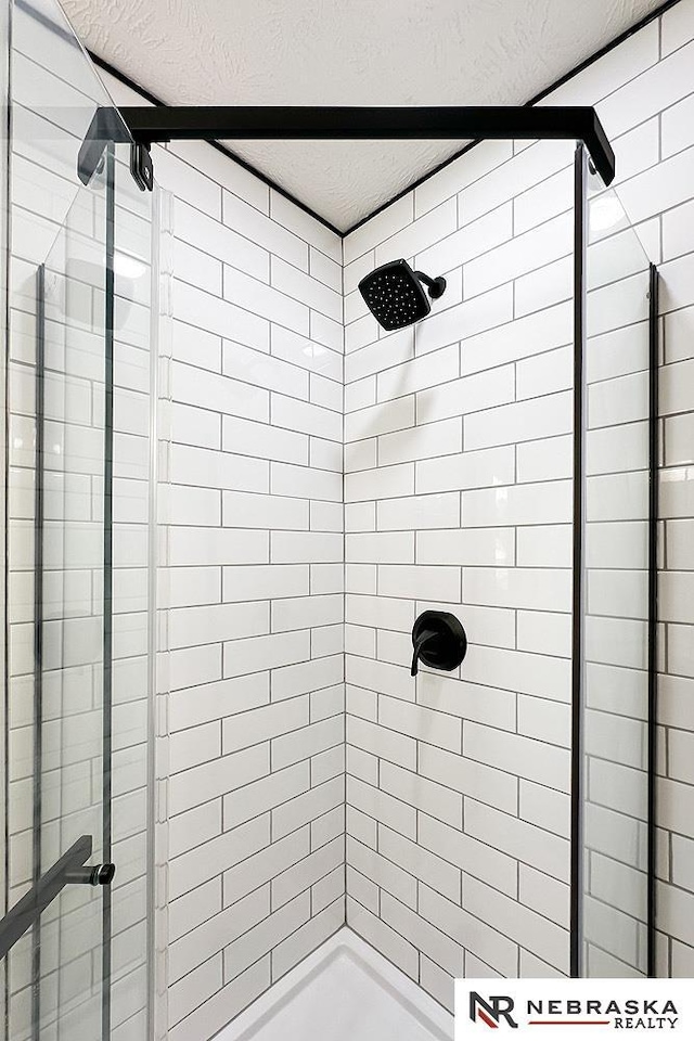 1113 S 94th St, Omaha, NE 68124 - bathroom featuring a textured ceiling and a stall shower