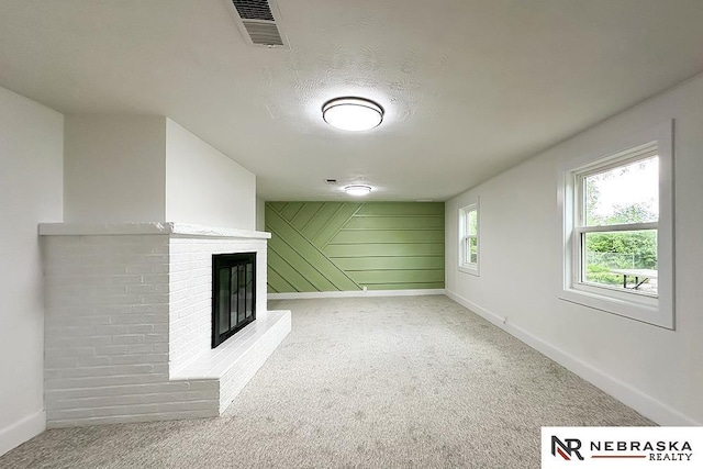 1113 S 94th St, Omaha, NE 68124 - unfurnished living room with a brick fireplace and light carpet