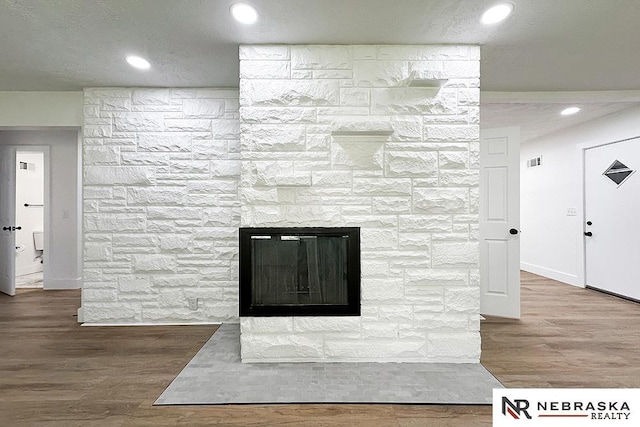 1113 S 94th St, Omaha, NE 68124 - detailed view of wood finished floors, a fireplace, and recessed lighting