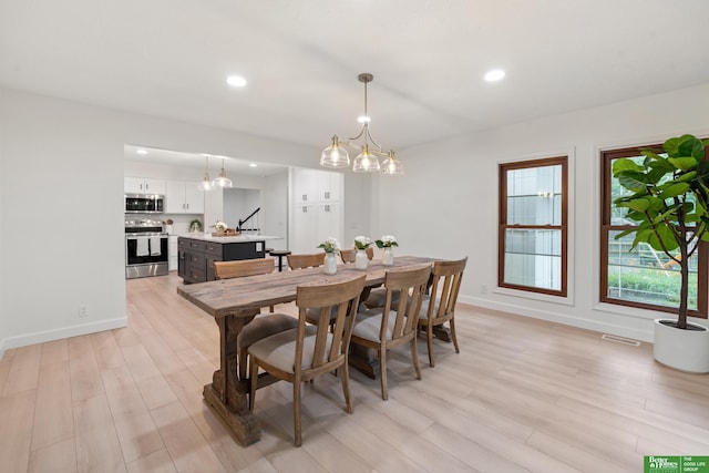 203 S 150th Cir, Omaha, NE 68154 - dining room with light wood-style floors, recessed lighting, and a chandelier