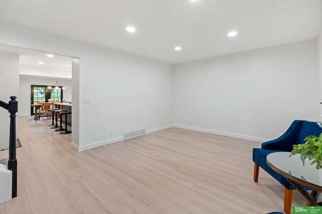 203 S 150th Cir, Omaha, NE 68154 - living area featuring light wood-style floors, recessed lighting, and a chandelier