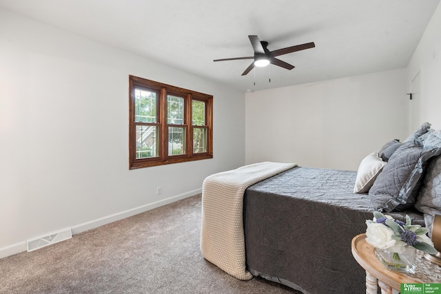 203 S 150th Cir, Omaha, NE 68154 - carpeted bedroom featuring baseboards and a ceiling fan