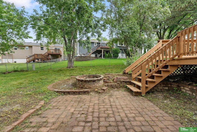203 S 150th Cir, Omaha, NE 68154 - fenced backyard with stairs, an outdoor fire pit, a deck, and a patio