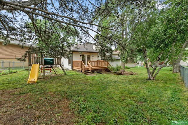 203 S 150th Cir, Omaha, NE 68154 - fenced backyard with a playground and a deck