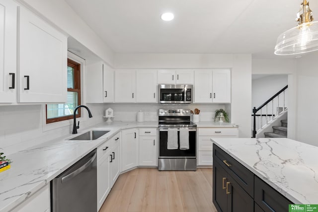 203 S 150th Cir, Omaha, NE 68154 - kitchen featuring appliances with stainless steel finishes, white cabinets, and recessed lighting